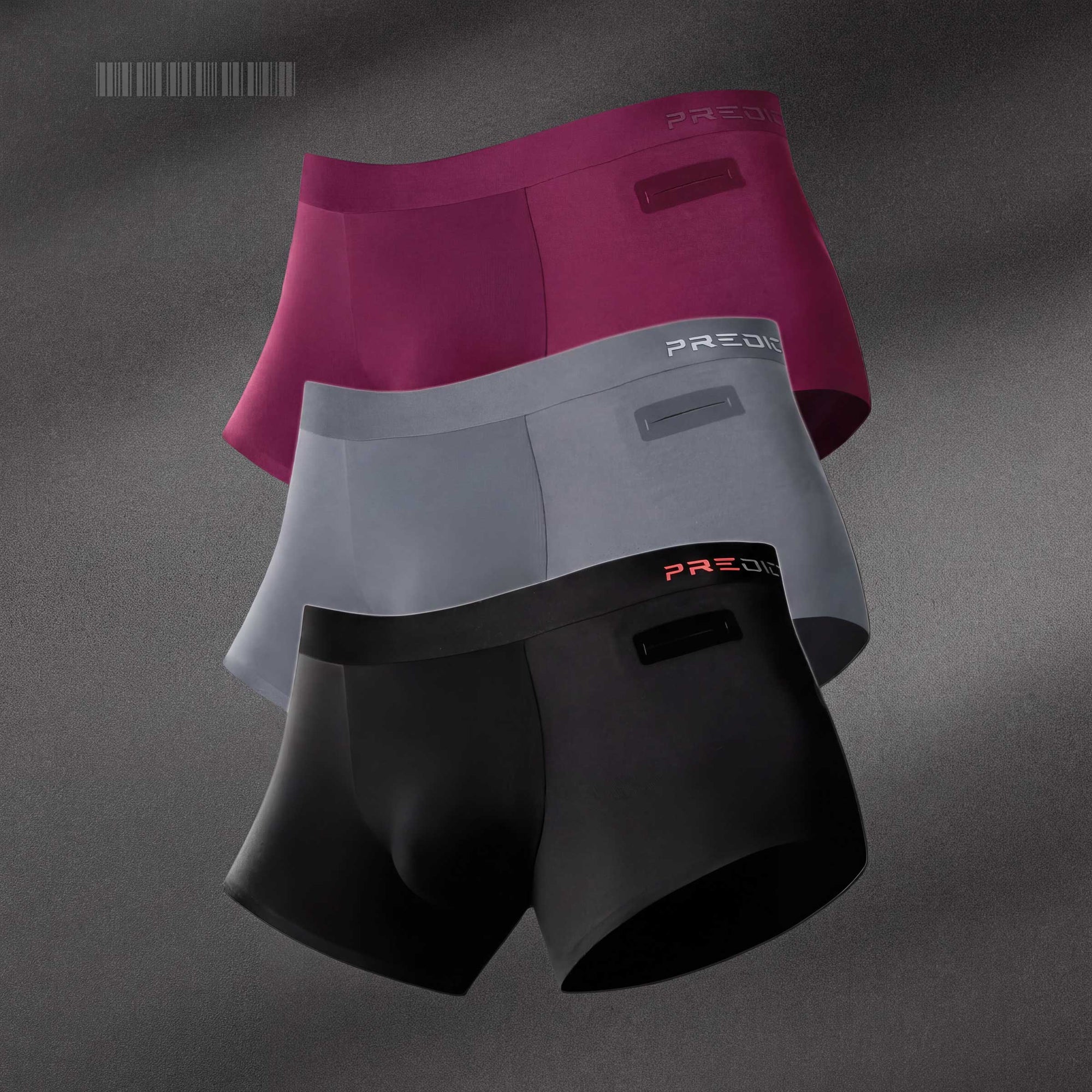 Three pairs of PREDICTION men's boxer briefs 4" Inseam, named RYDER in black, storm grey, and burgundy.