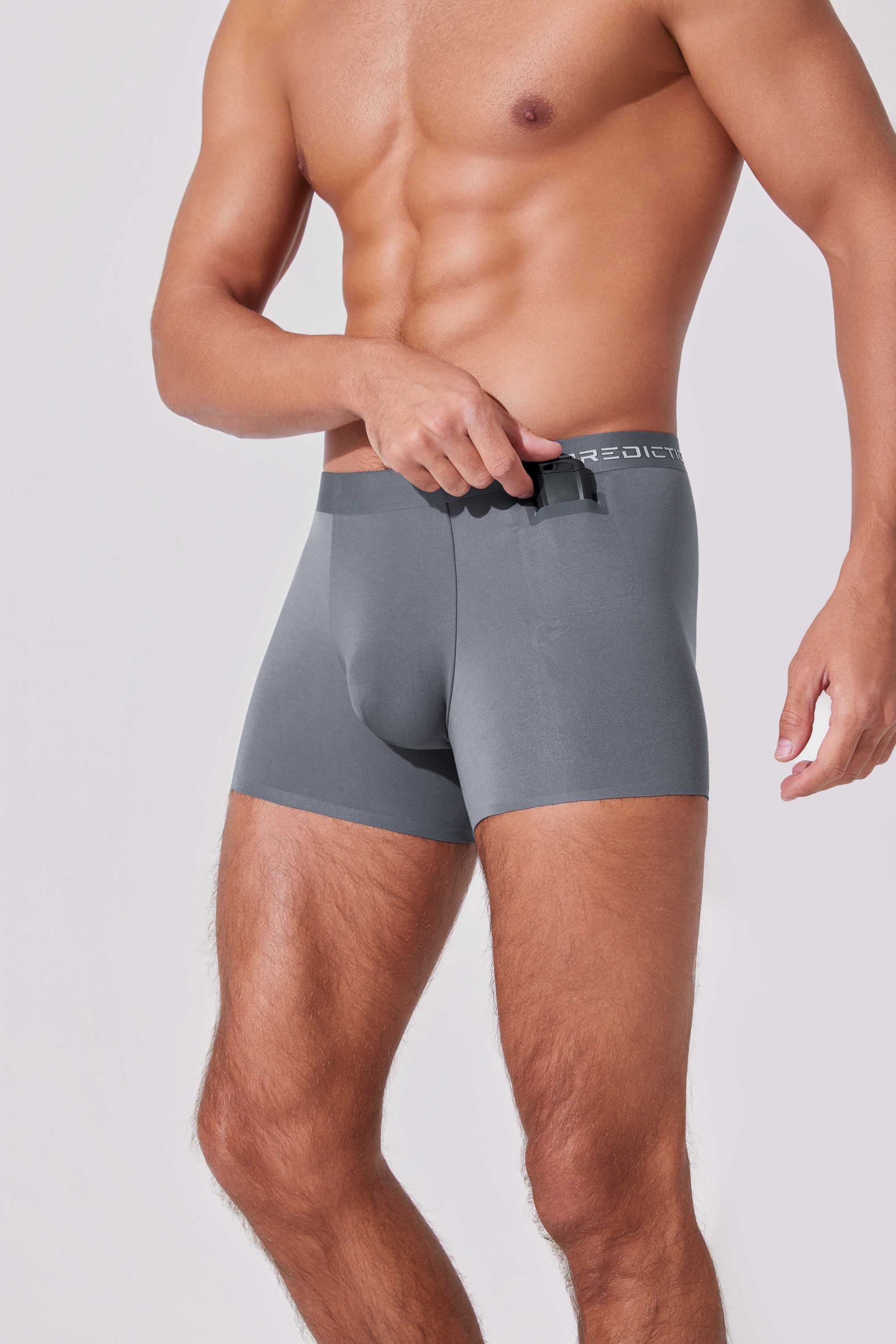 Men’s boxer briefs with hidden pocket holding AirPods for easy access