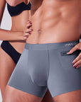 Couple interacting with pocket in storm grey boxer briefs showing functional pocket use